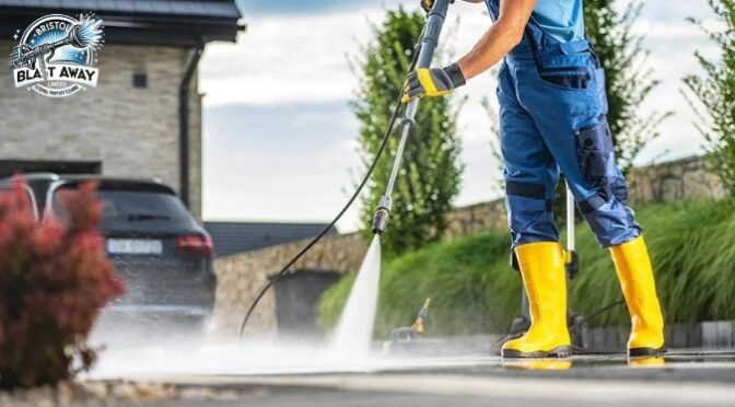 man cleaning Patio with pressure washing