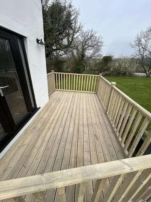 Wooden decking after deep cleaning service by Bristol Blast Away in Nailsea, Bristol. Natural timber fully restored ready for oiling or sealing.